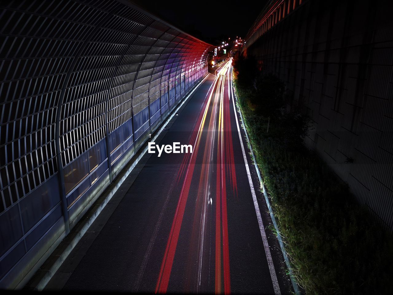 High angle view of light trails on road at night