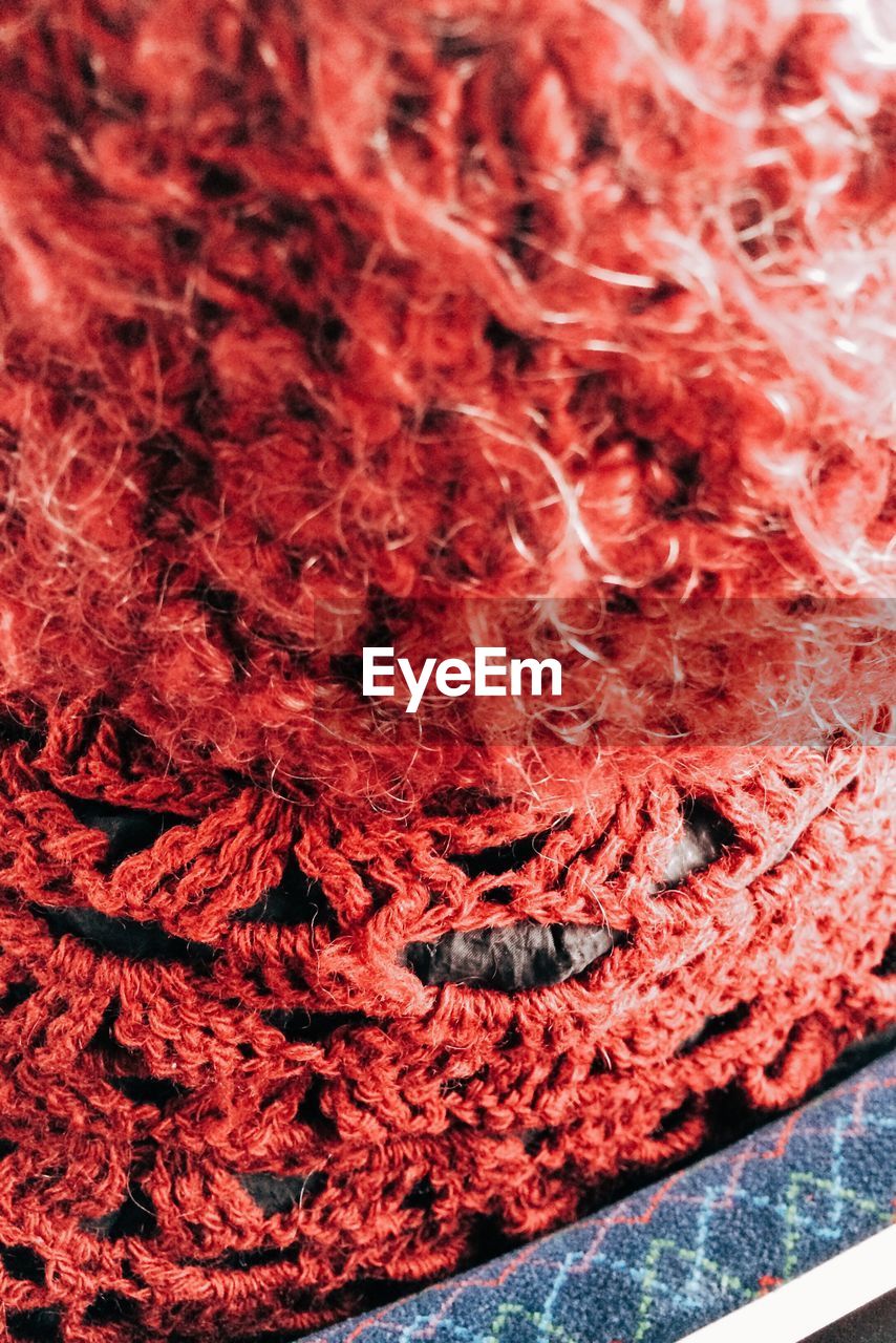 Close-up of red woolen hat