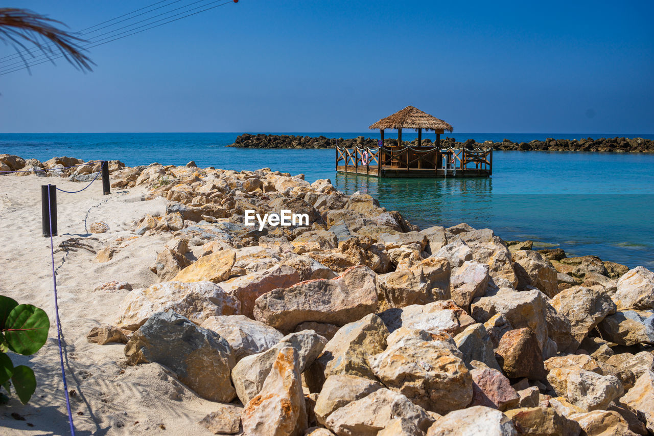 scenic view of sea against clear blue sky