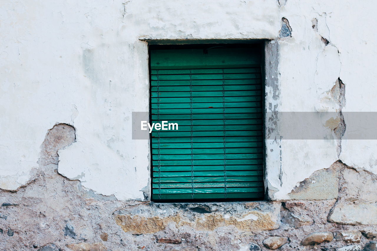 Closed window of old building