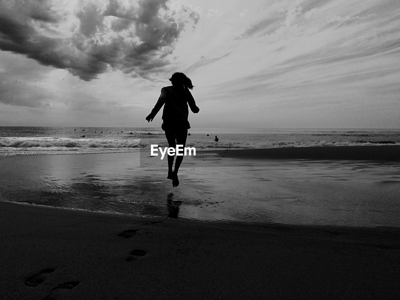 Girl running towards sea