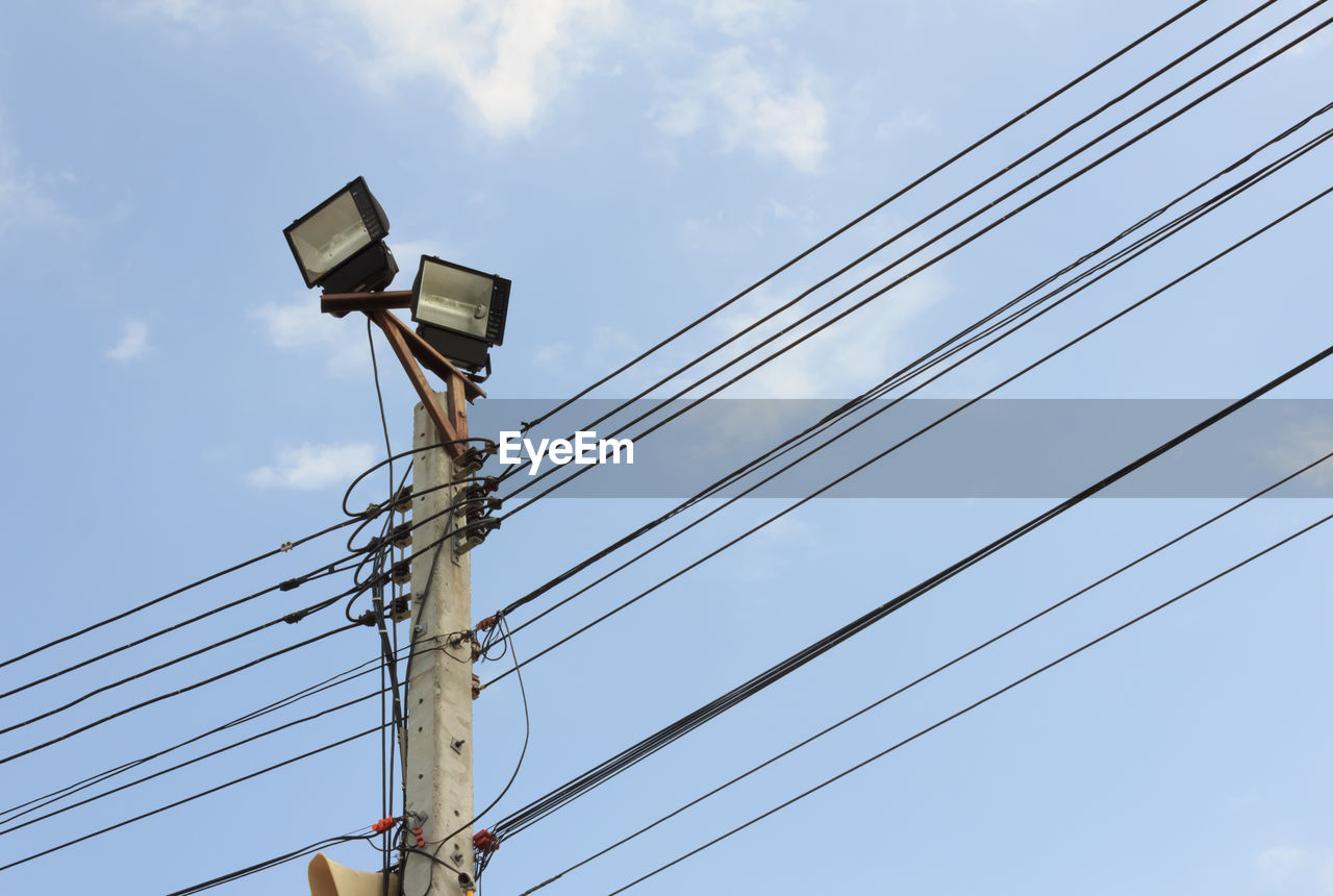 Low angle view of power line against sky