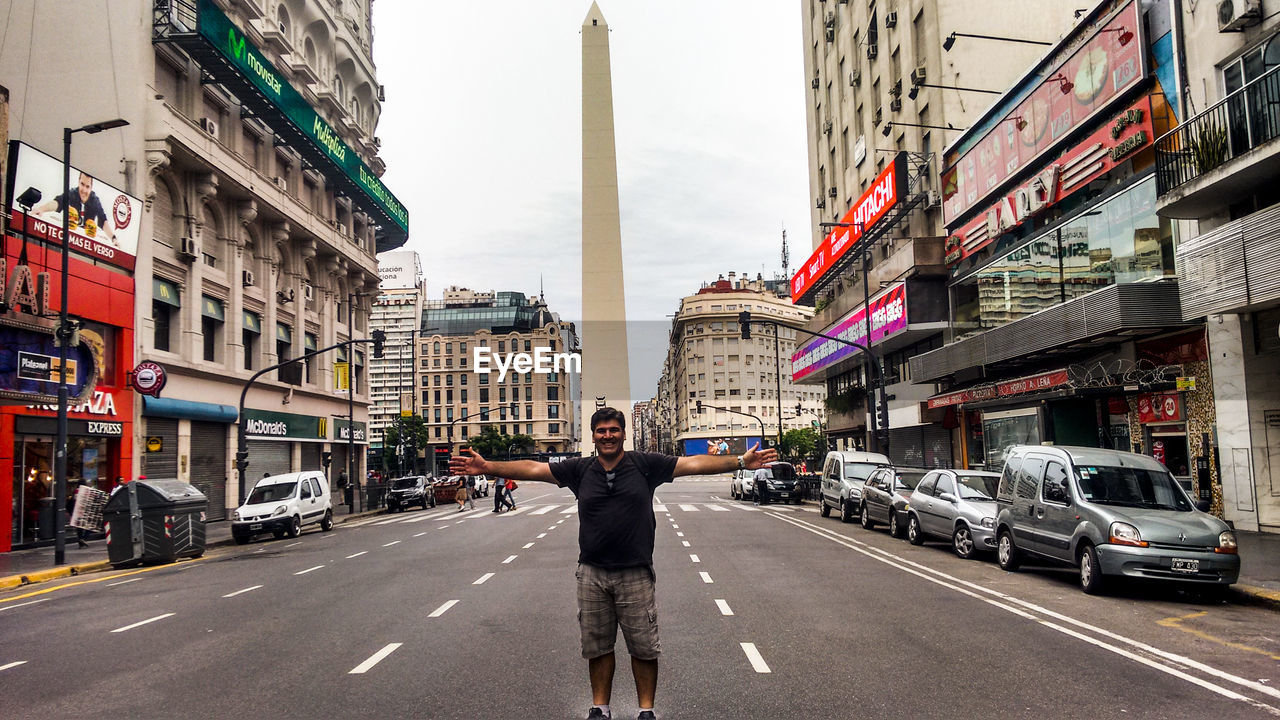 MAN STANDING ON ROAD