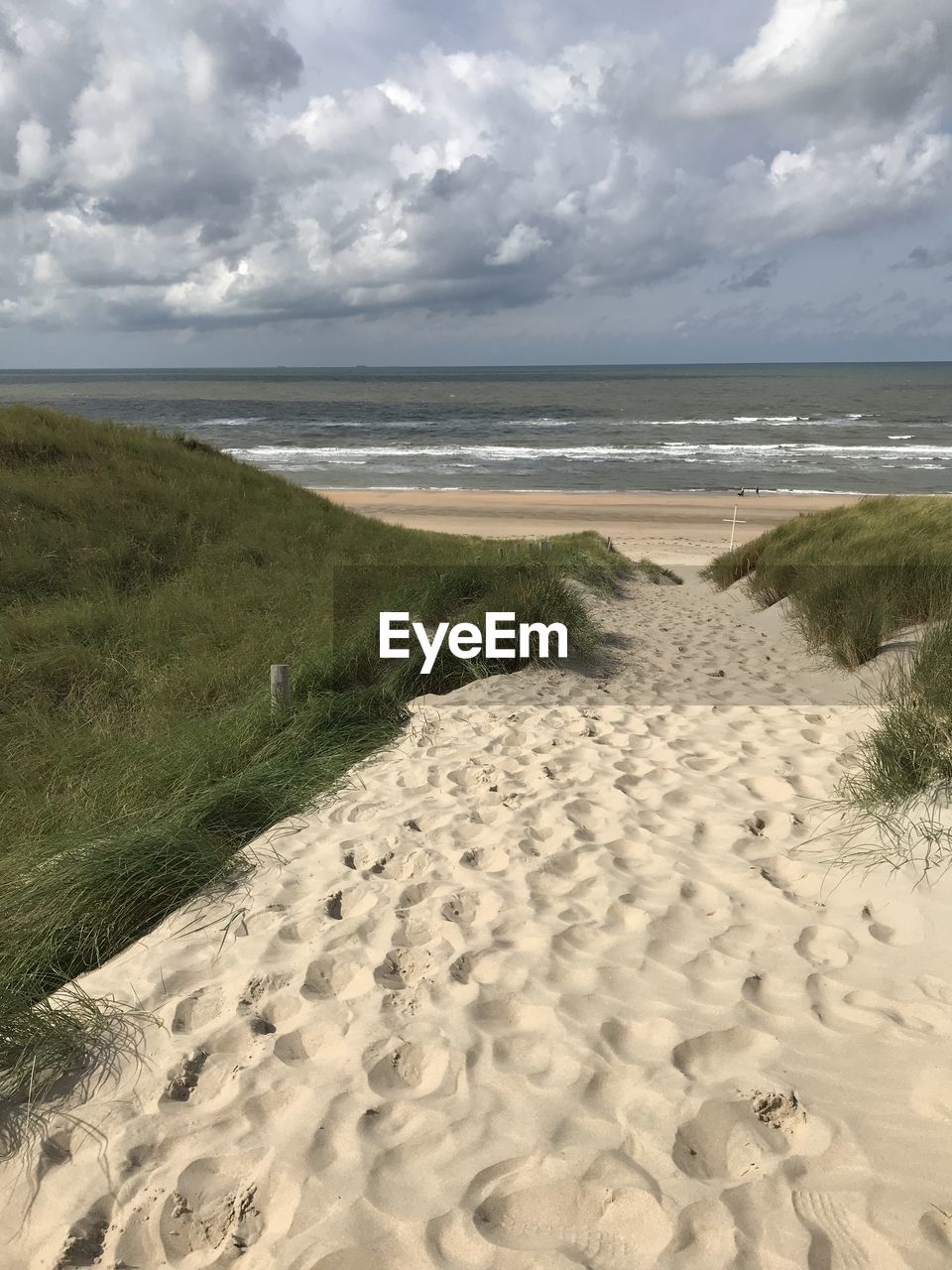 SCENIC VIEW OF SANDY BEACH AGAINST SKY