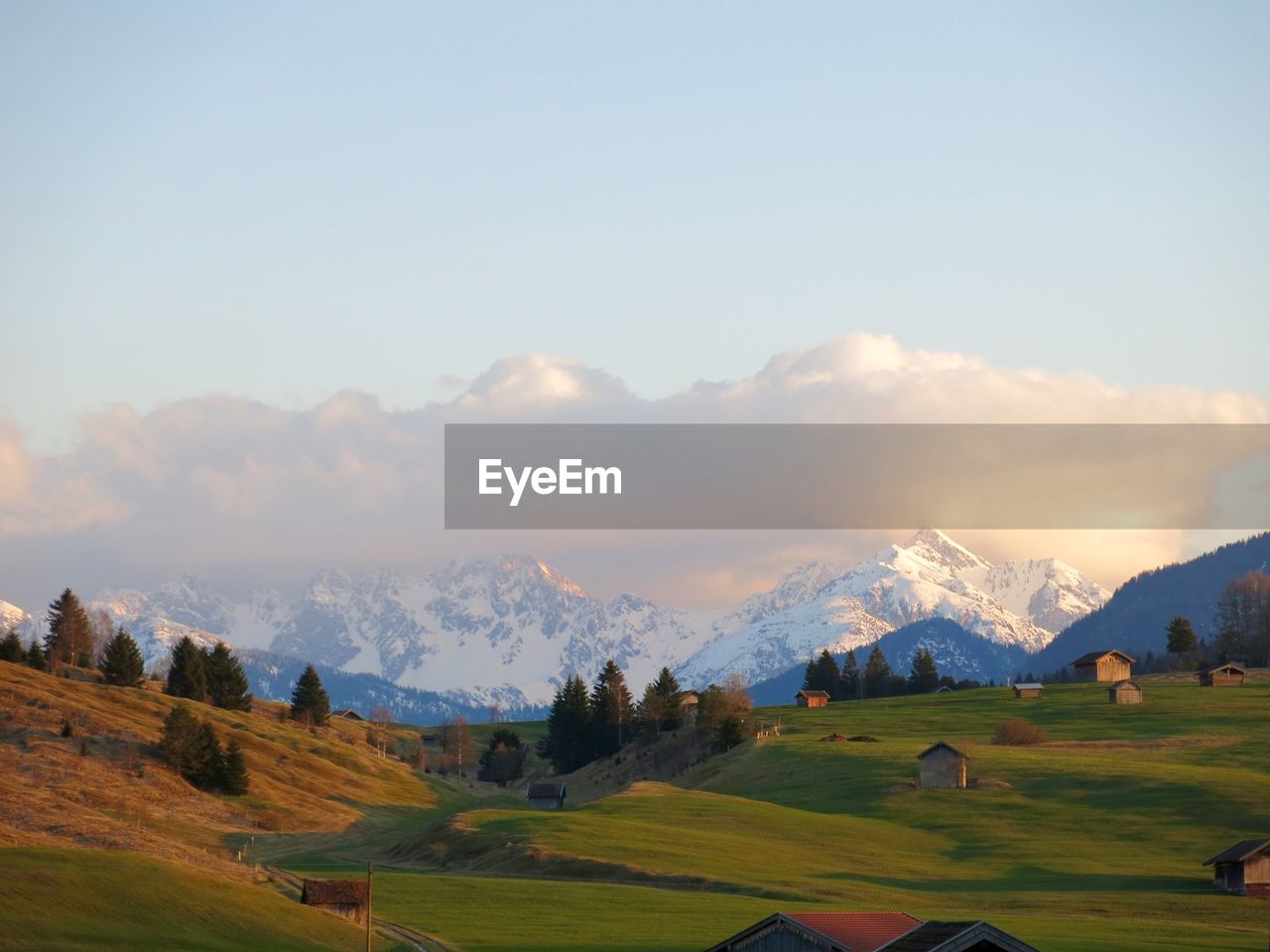 Clouds over snowcapped mountains