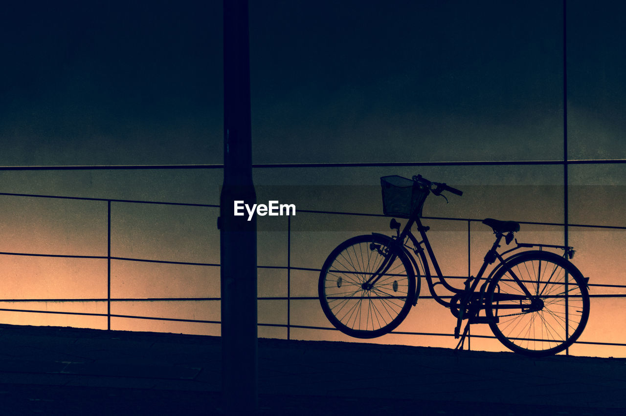 BICYCLE AGAINST SKY DURING SUNSET