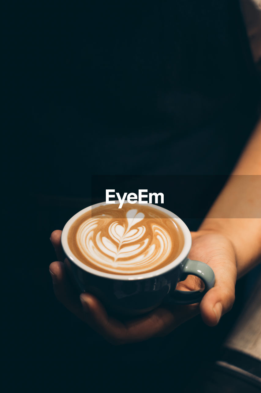 HIGH ANGLE VIEW OF COFFEE CUP WITH CAPPUCCINO