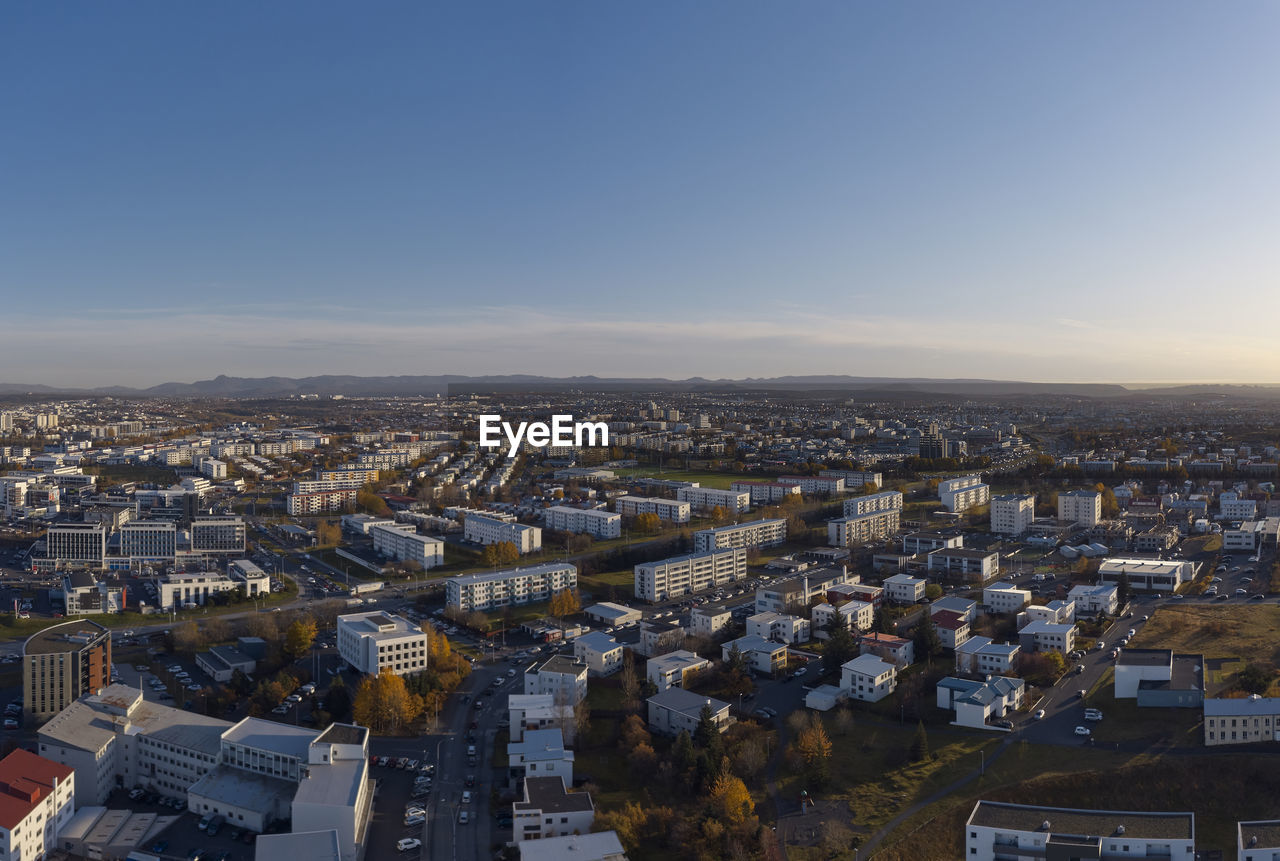 Sunset cityscape of modern city in autumn