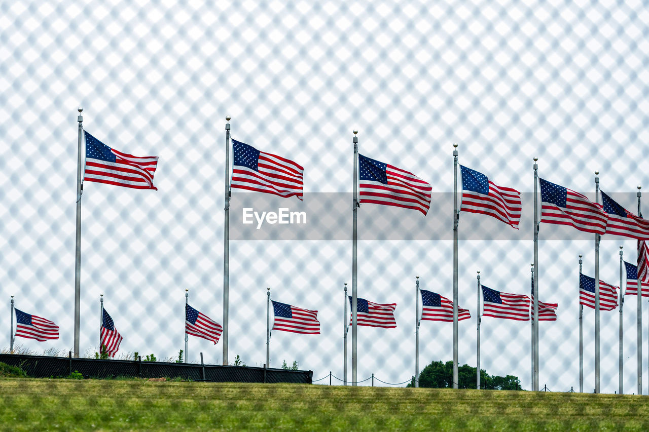 FLAGS SIGN AGAINST SKY WITH FLAG