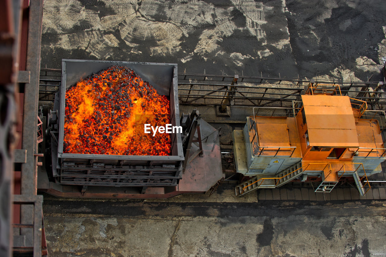 High angle view of engine on tracks at factory