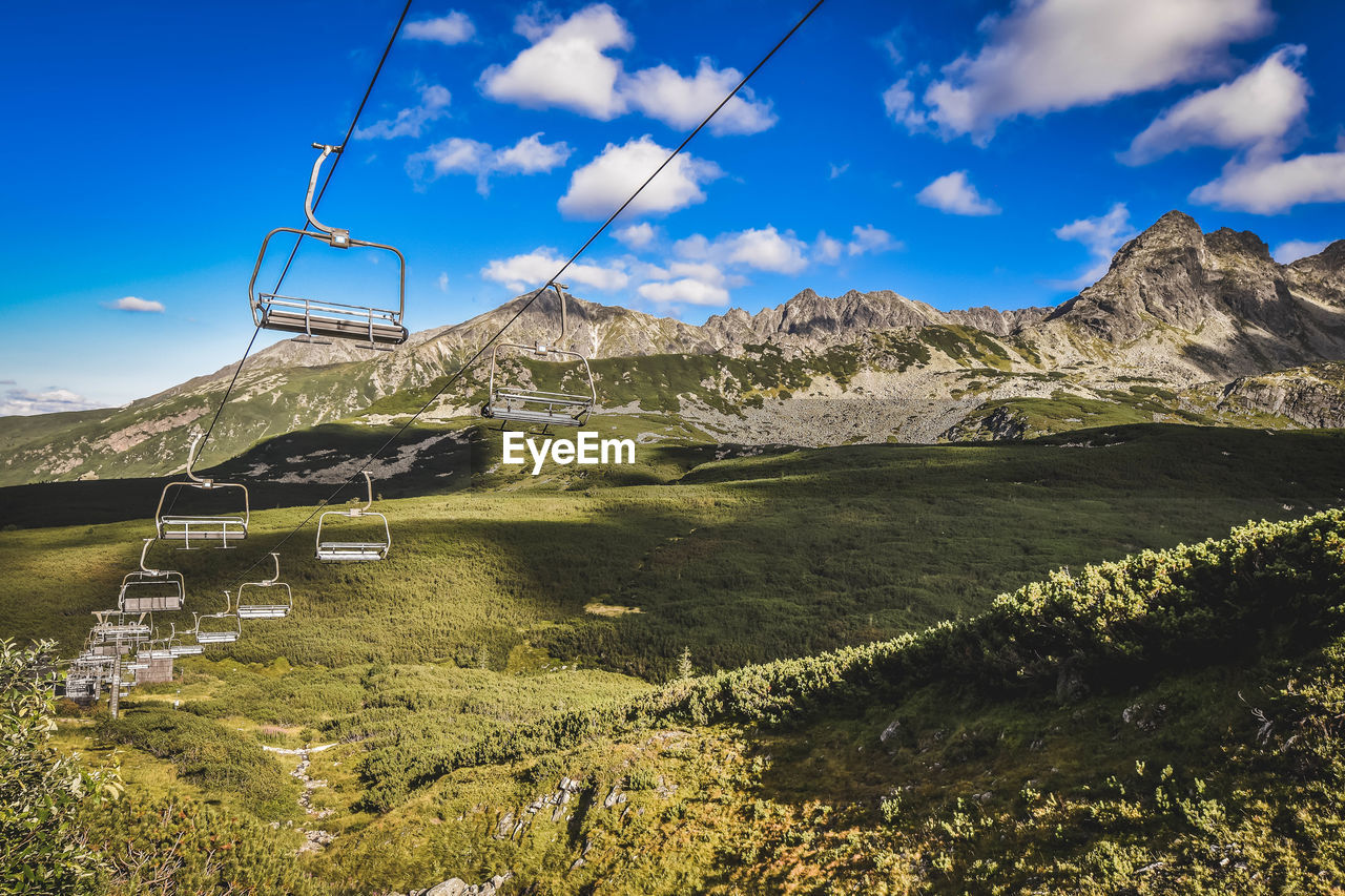 Low angle view of ski lift against sky