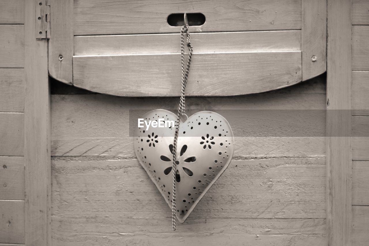 Close-up of heart shape on door
