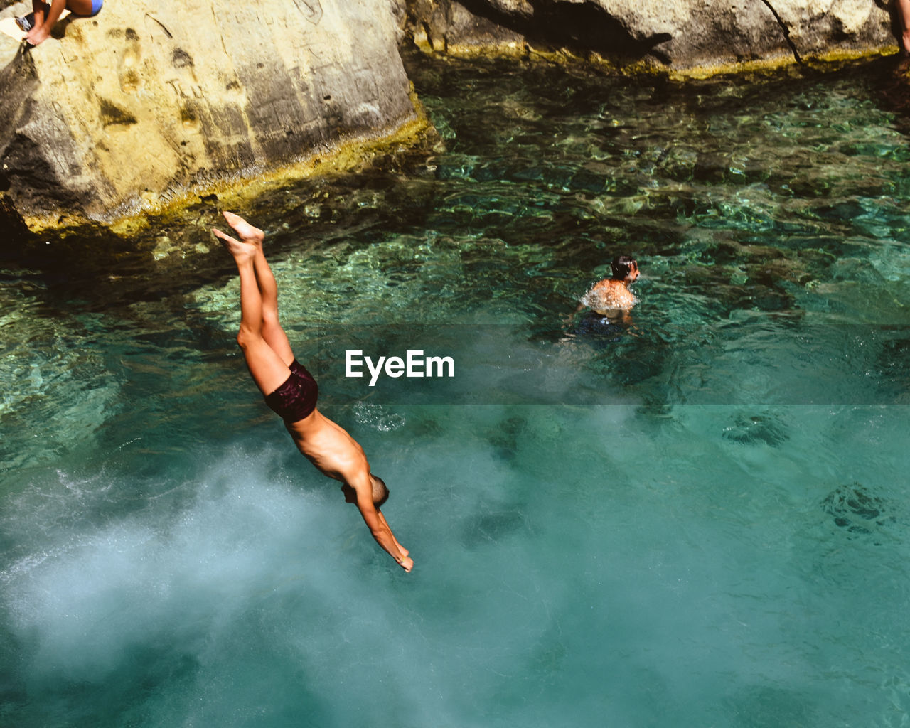 High angle view of man diving into sea