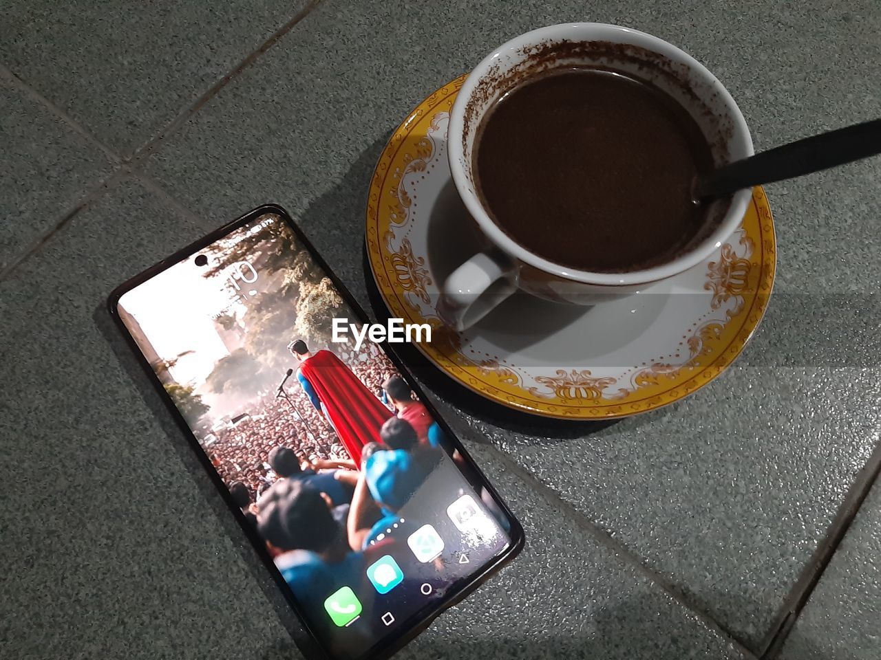 cup, high angle view, drink, mug, food and drink, coffee, coffee cup, smartphone, wireless technology, portable information device, refreshment, mobile phone, communication, technology, hot drink, directly above, table, crockery, city, saucer