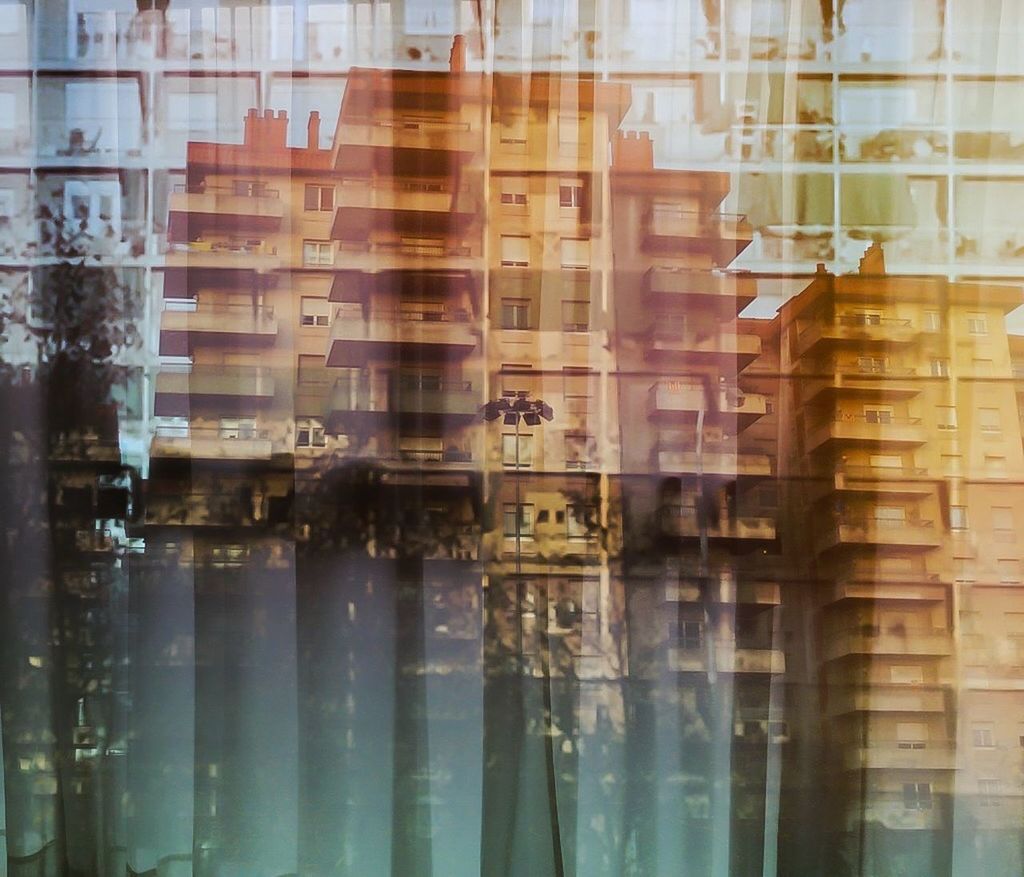 REFLECTION OF BUILDINGS IN WATER