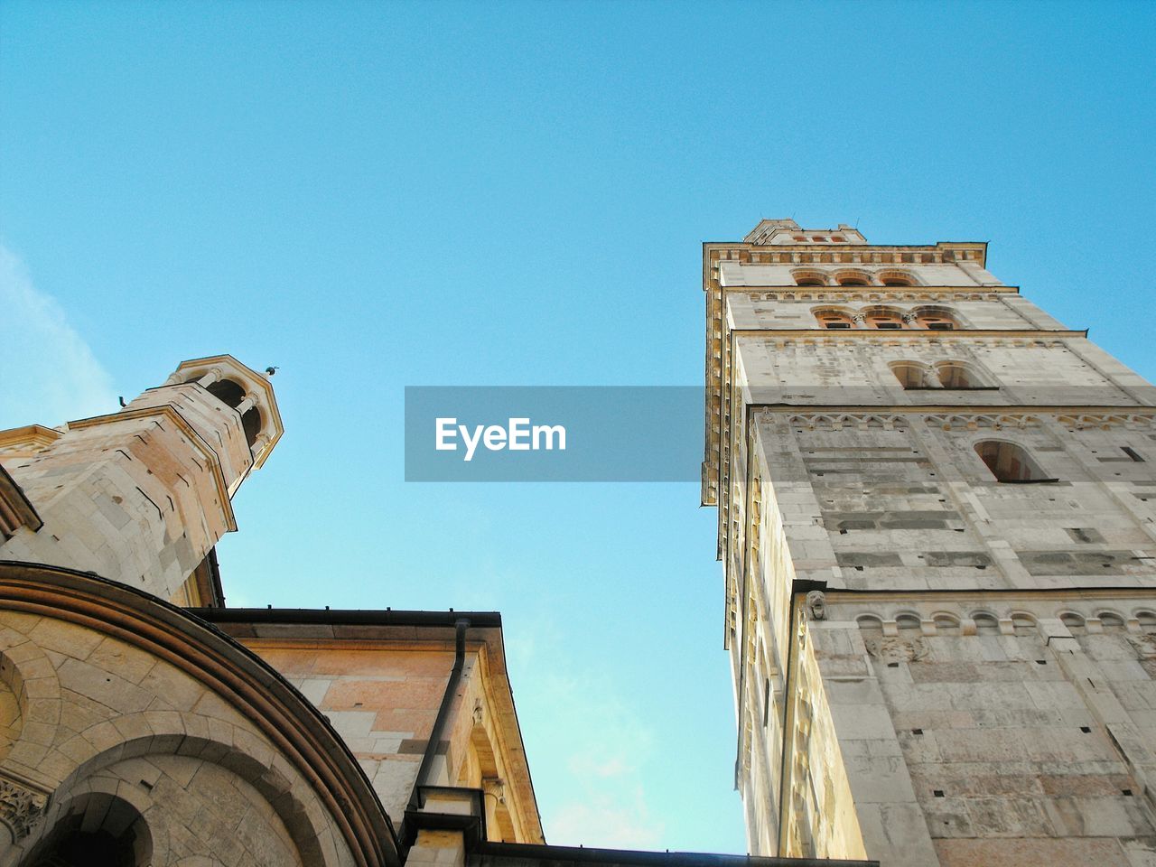 Low angle view of building against blue sky