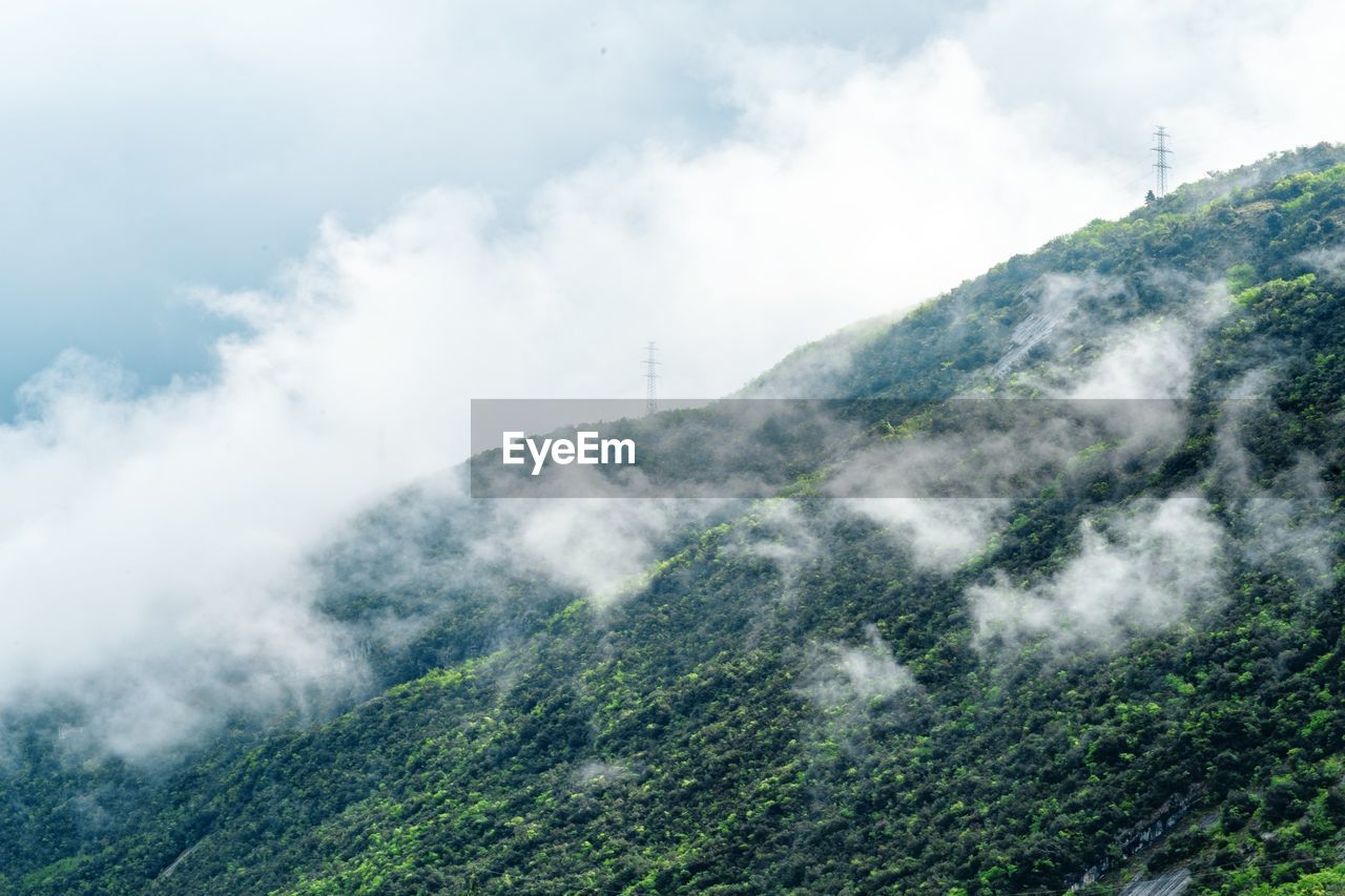 Scenic view of fog landscape against sky