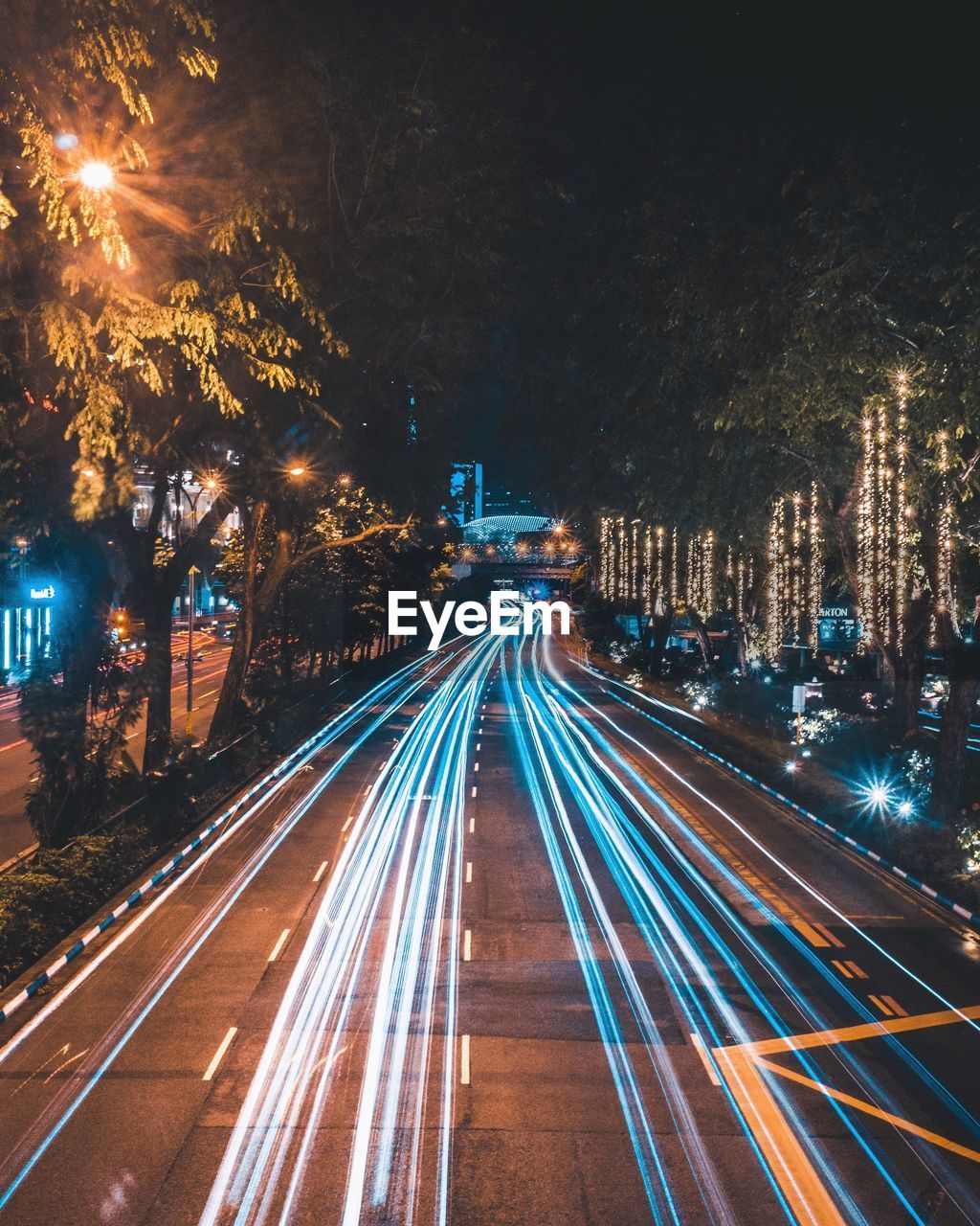 High angle view of light trails on road in city at night