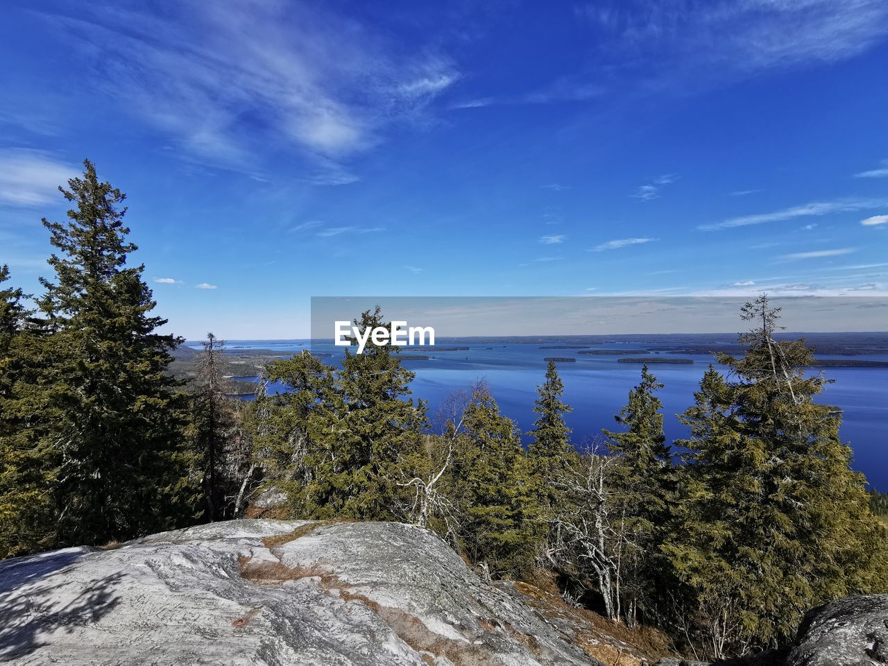 Scenic view of rocks against blue sky