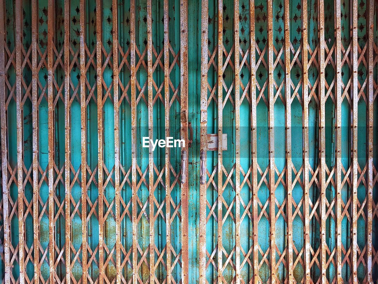 Full frame shot of rusty metallic gate