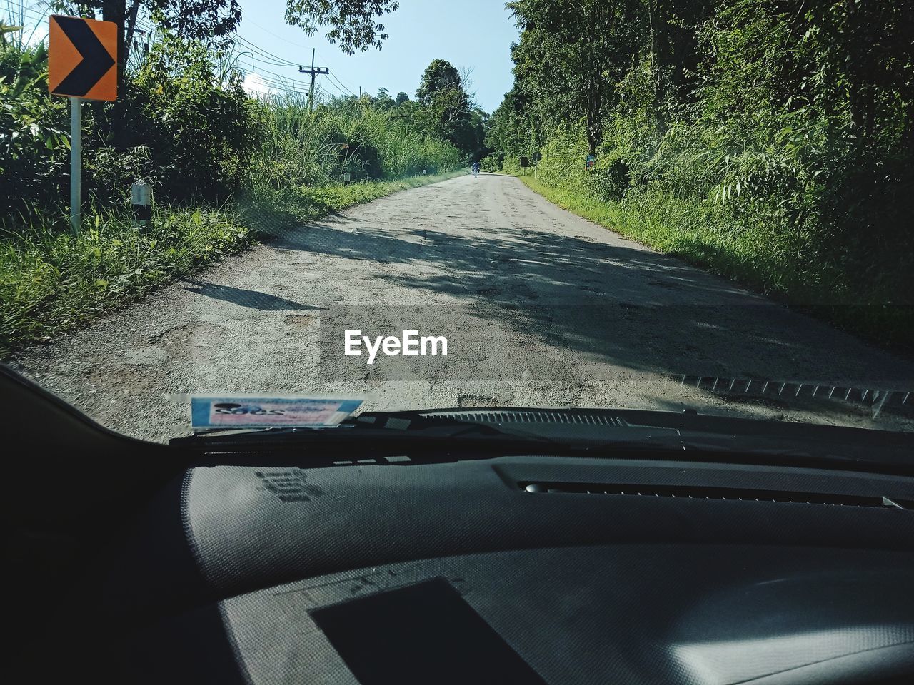 ROAD SEEN THROUGH CAR WINDOW