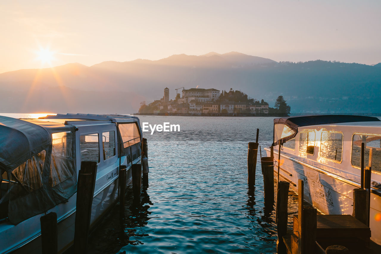 View of the san giulio island on lake orta at sunset