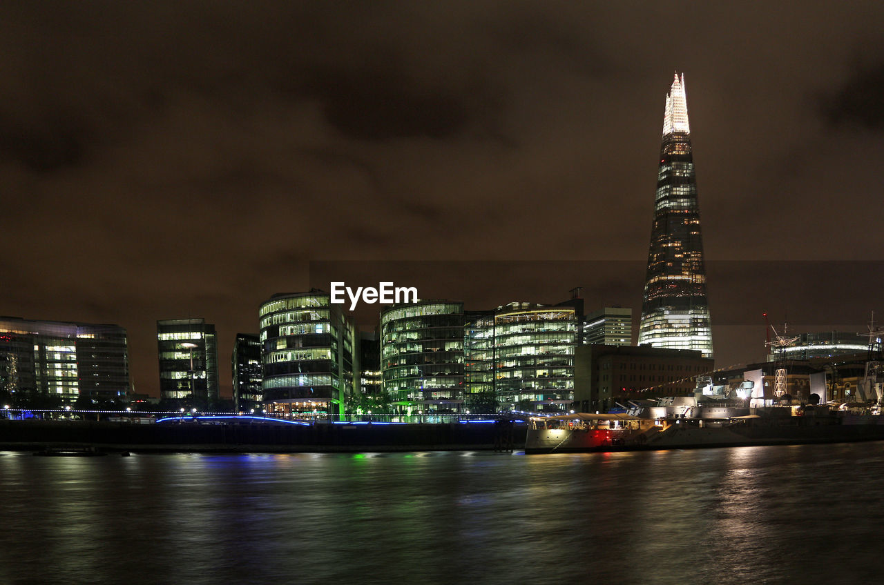 Illuminated buildings in city at night