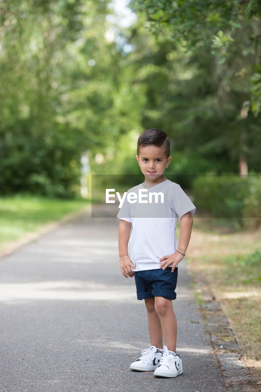 PORTRAIT OF A BOY WITH ROAD