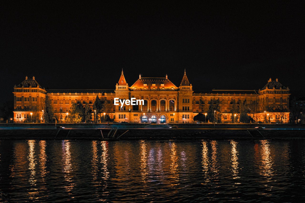 Illuminated buildings in city at night