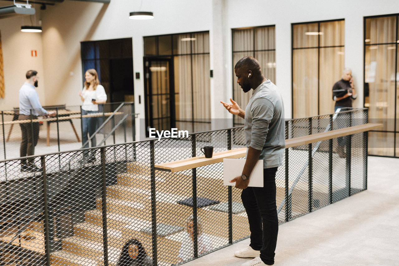 Man on the phone in office building