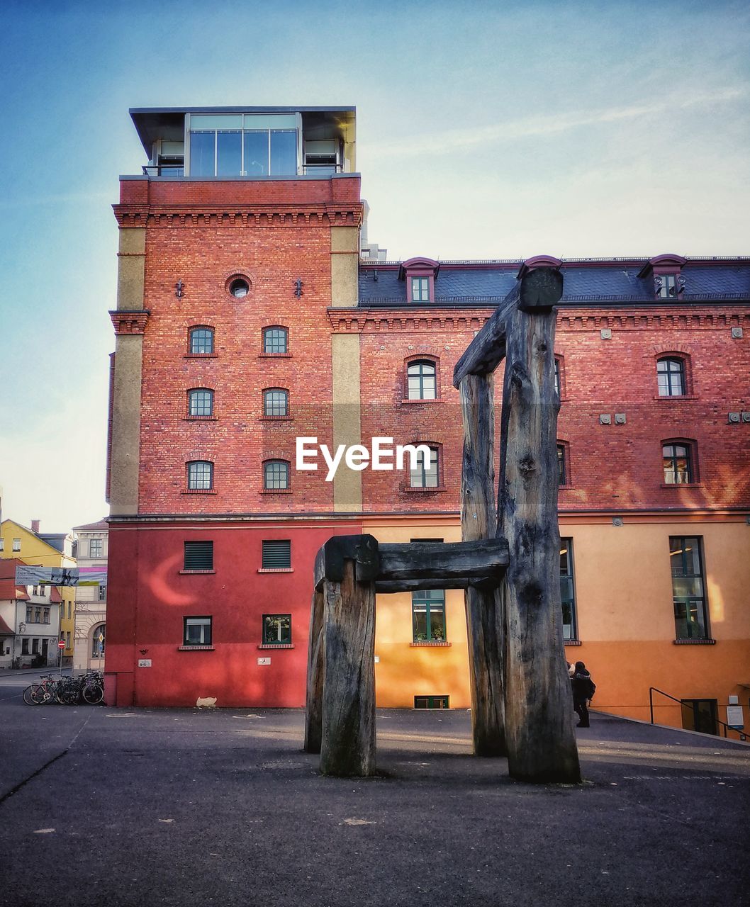 OLD BUILDINGS AGAINST SKY AT DUSK