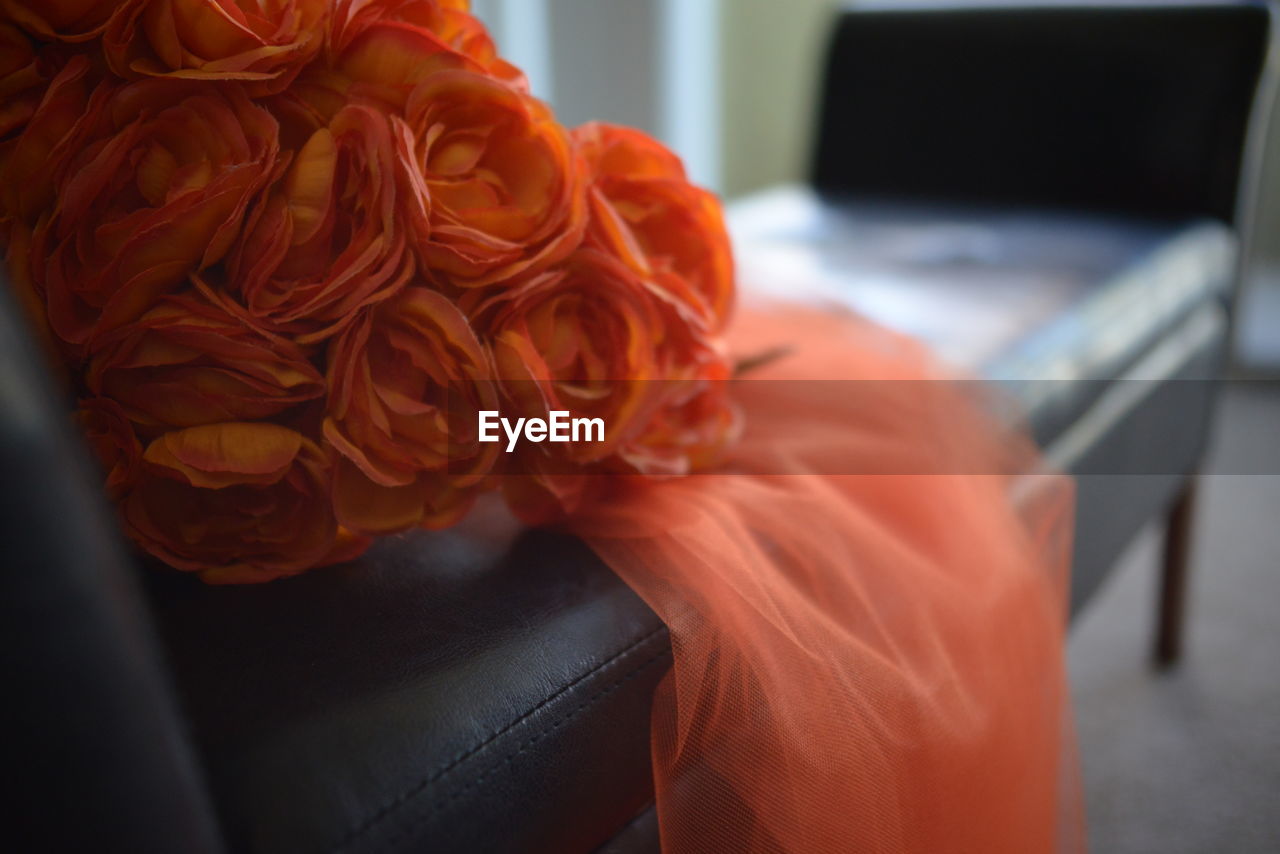 Close-up of red rose on table