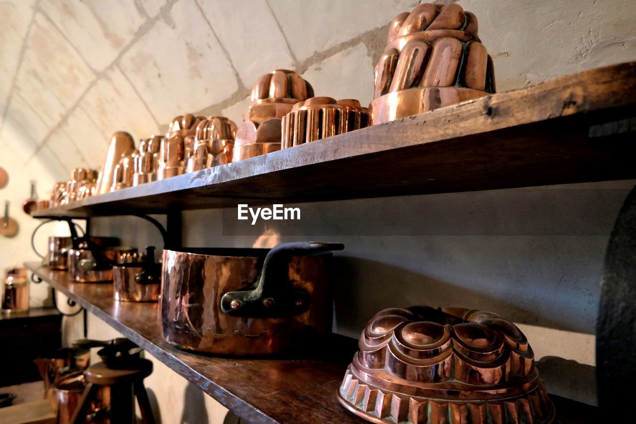 View of utensils on shelf kitchen at home