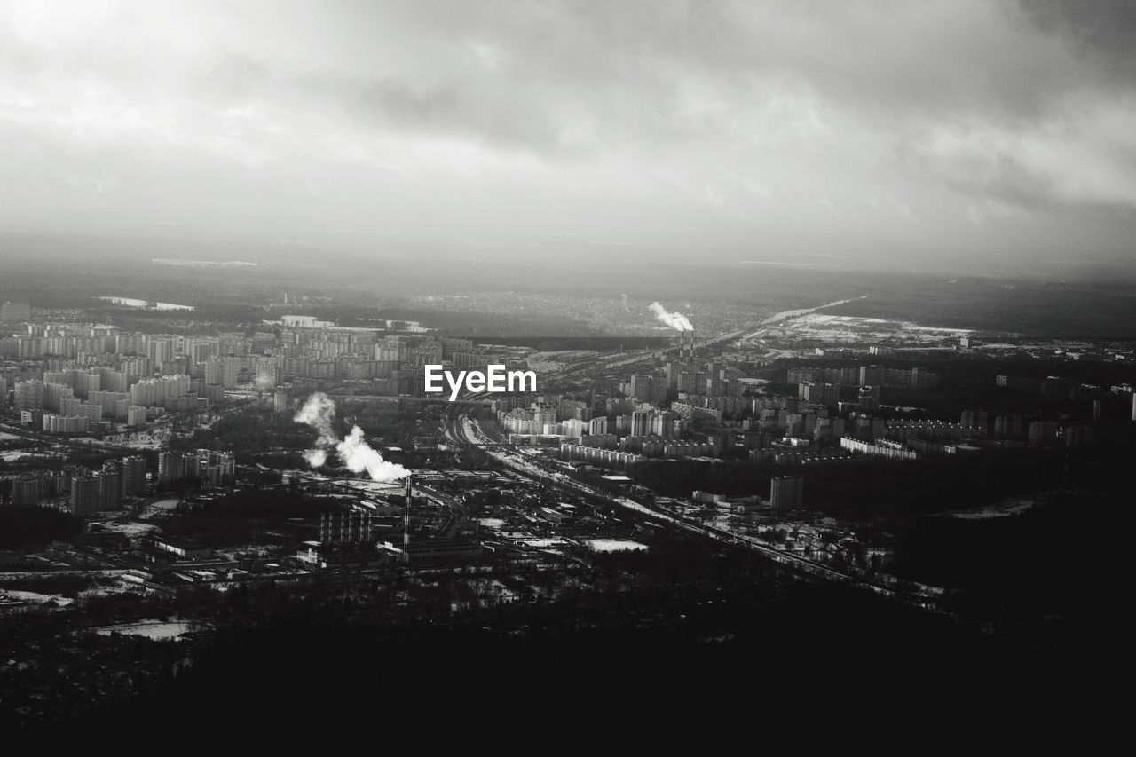 Aerial view of cityscape against sky
