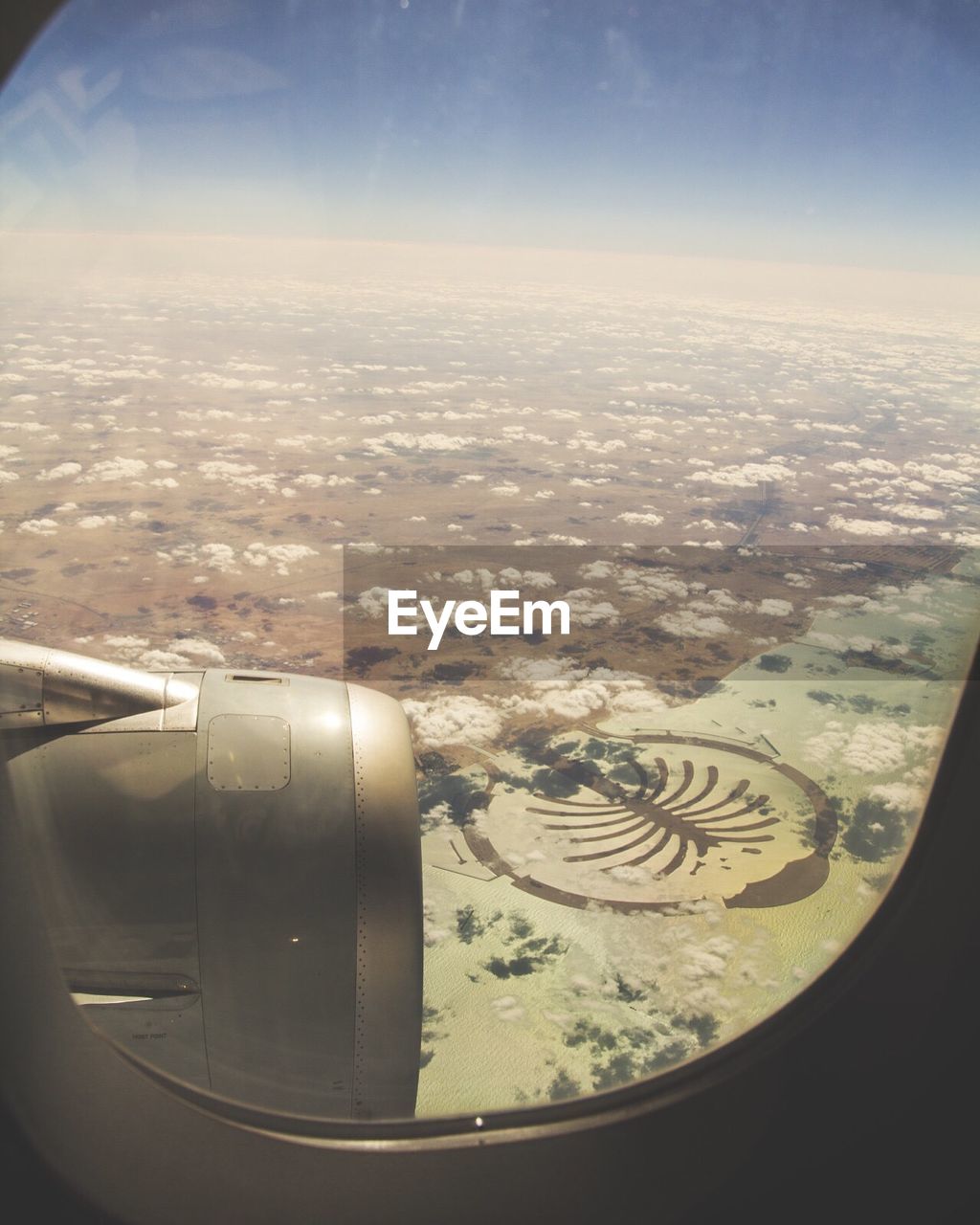 Scenic view of landscape seen through airplane window