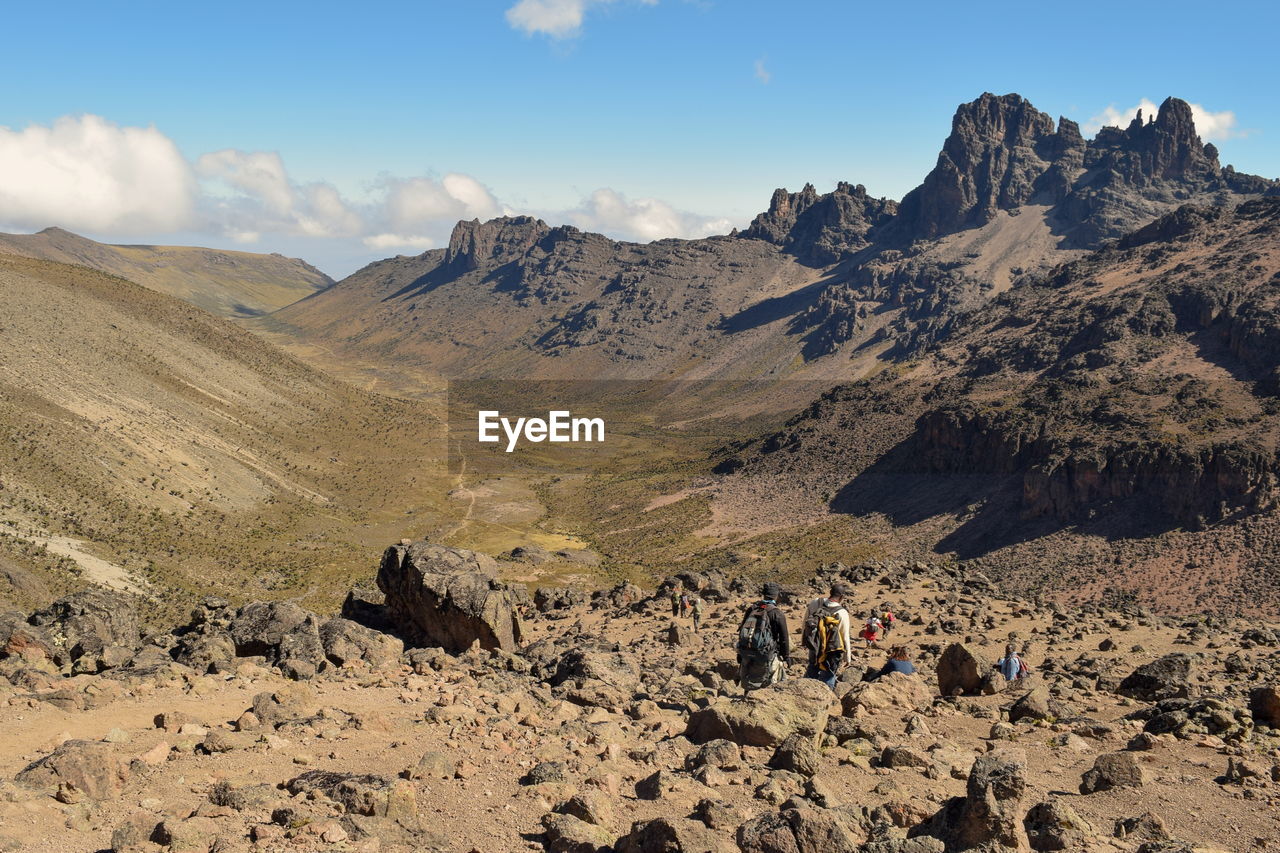 People on mountain during sunny day