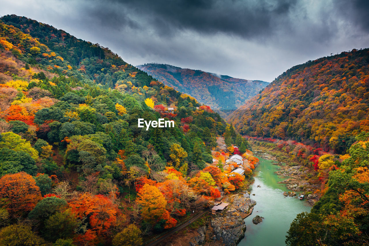 Scenic view of mountains against cloudy sky