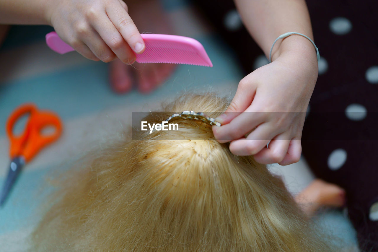 Girl hairstyling doll