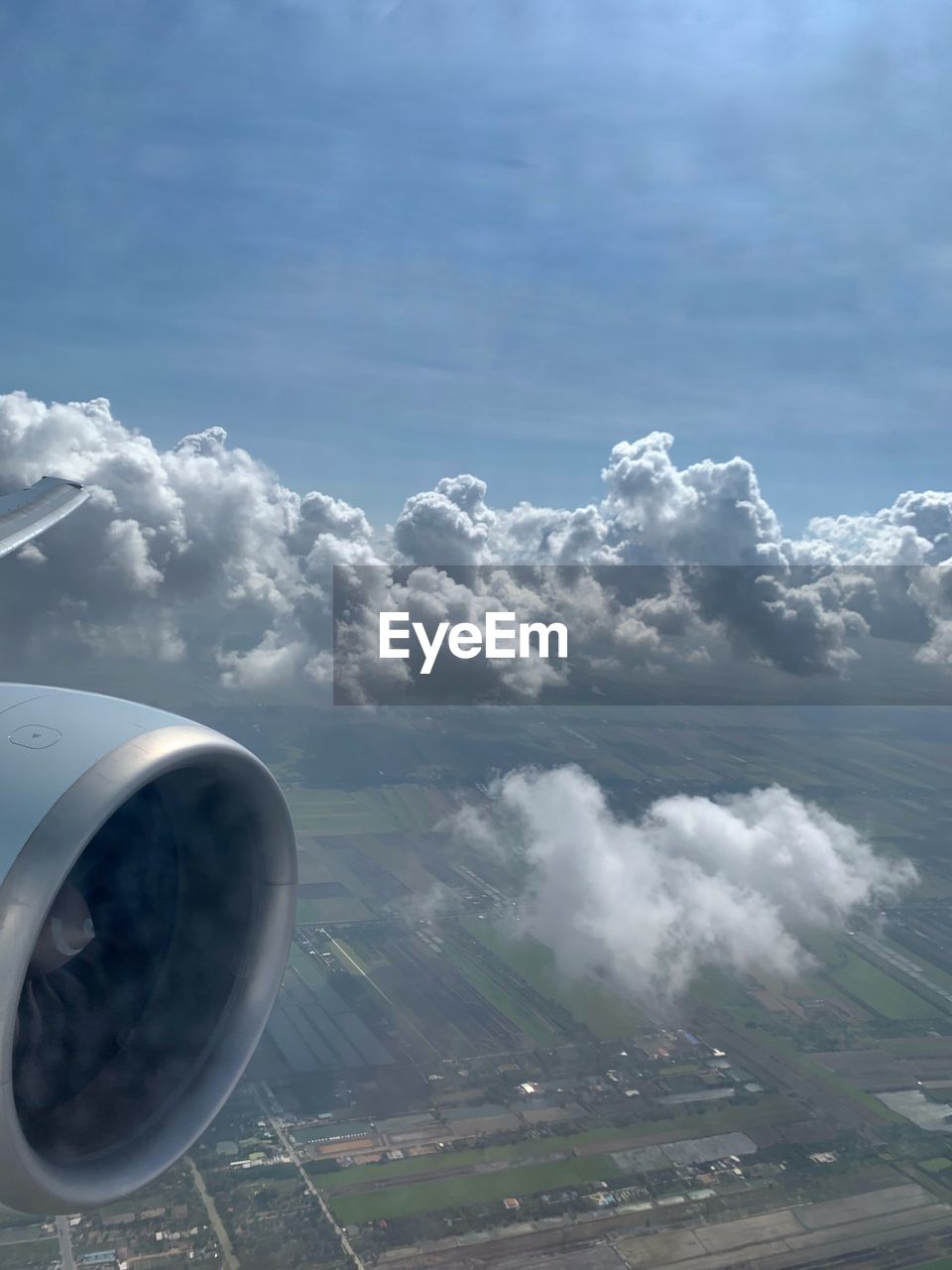 AERIAL VIEW OF CLOUDS OVER AIRPLANE