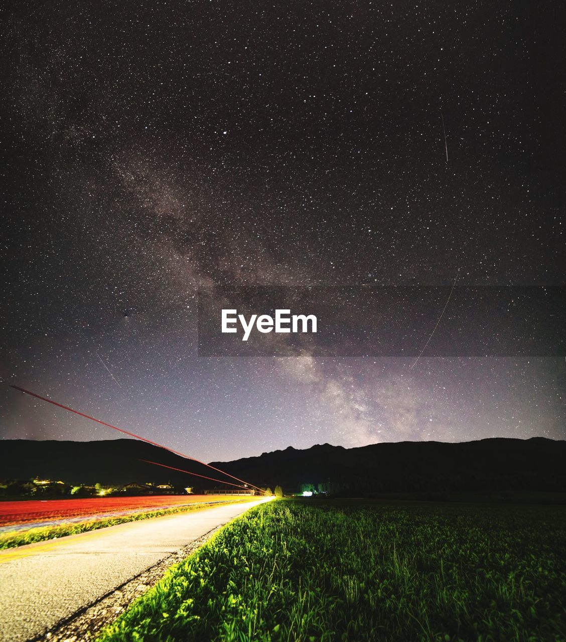 Scenic view of field against sky at night