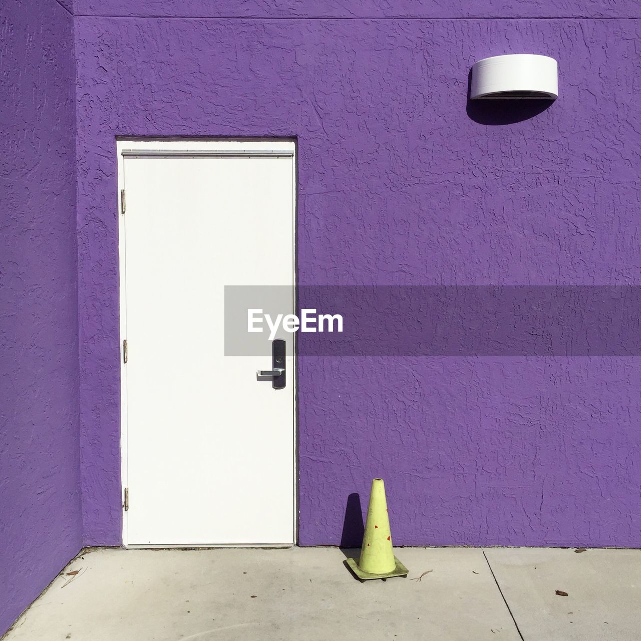 Purple wall with closed door