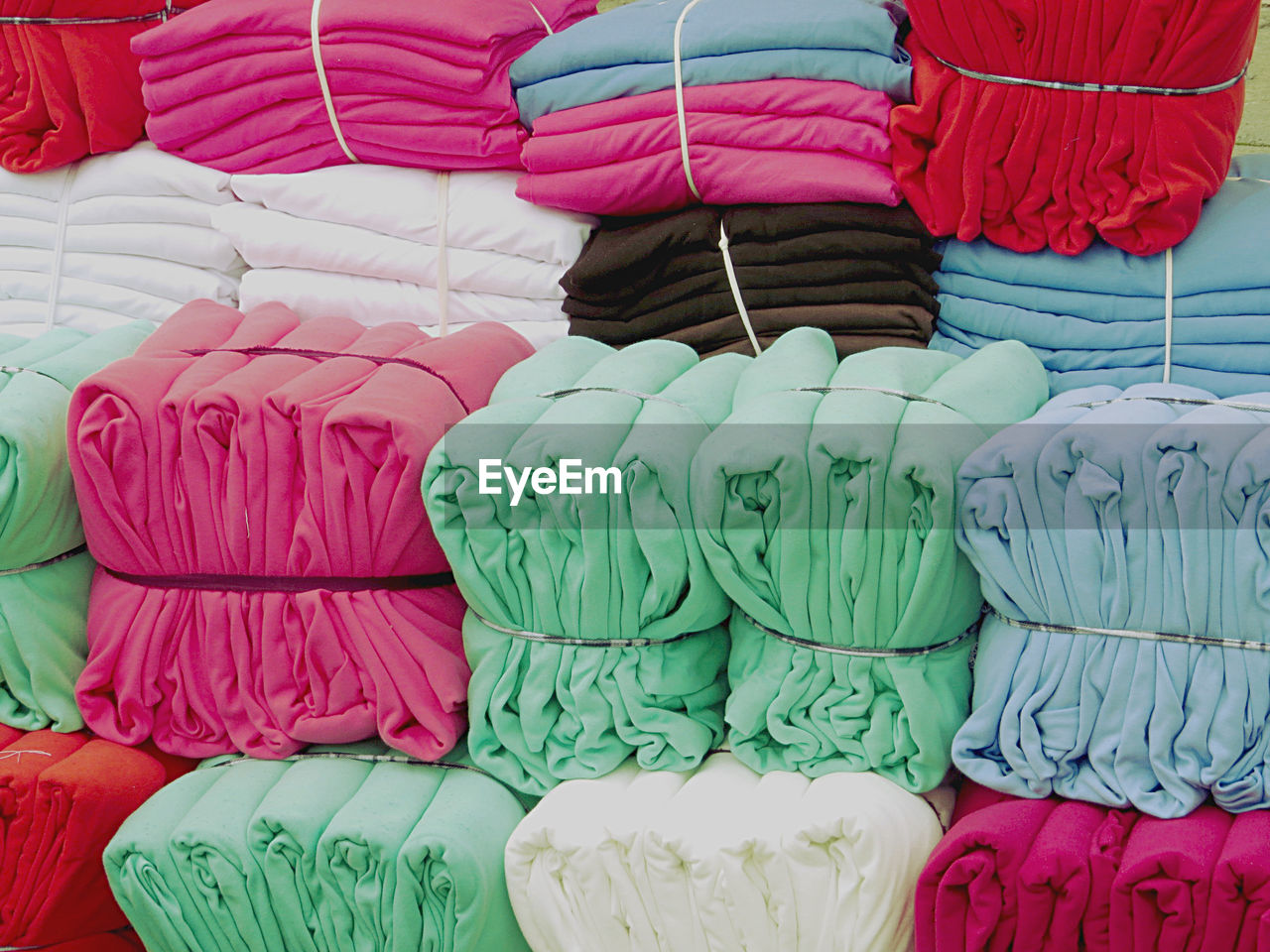 Full frame shot of folded colorful fabrics at store