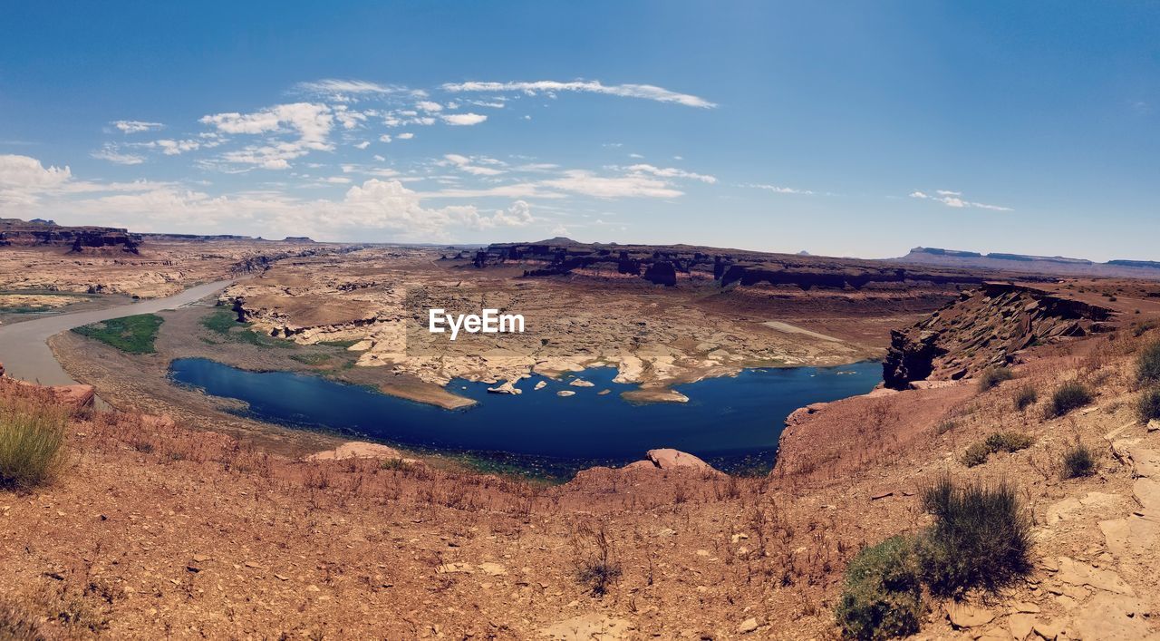 Panoramic view of arid landscape against sky