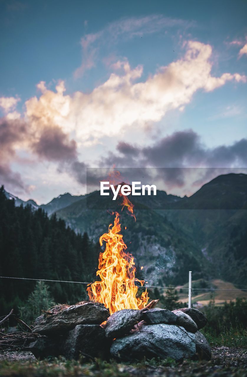 Campfire on ground against sky