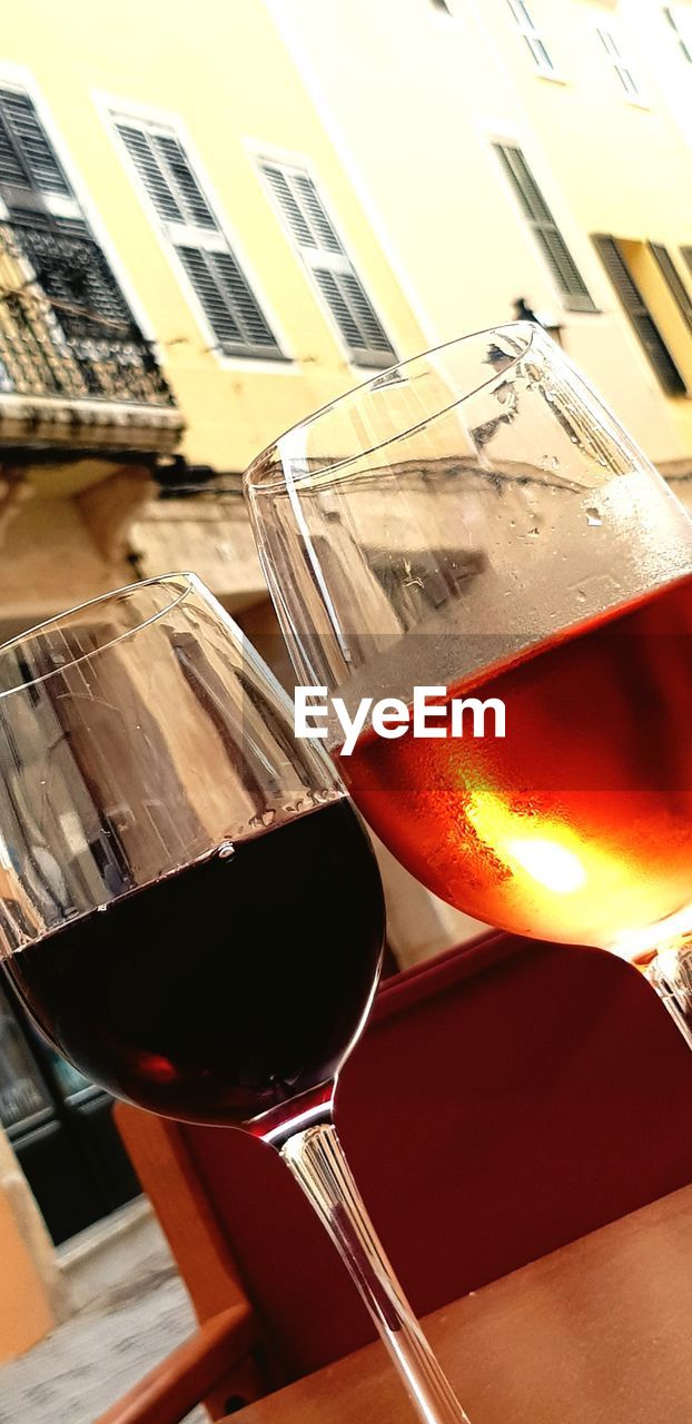 CLOSE-UP OF BEER GLASS ON TABLE