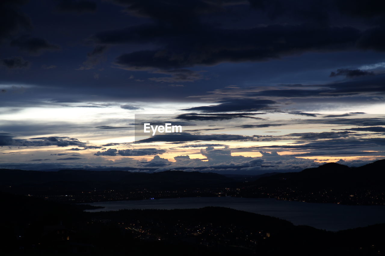 SCENIC VIEW OF SILHOUETTE MOUNTAIN AGAINST SKY