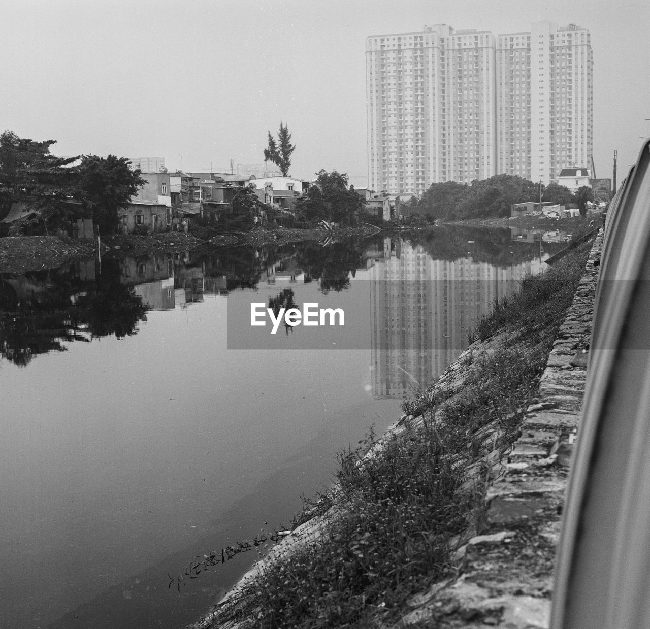 REFLECTION OF BUILDINGS IN LAKE