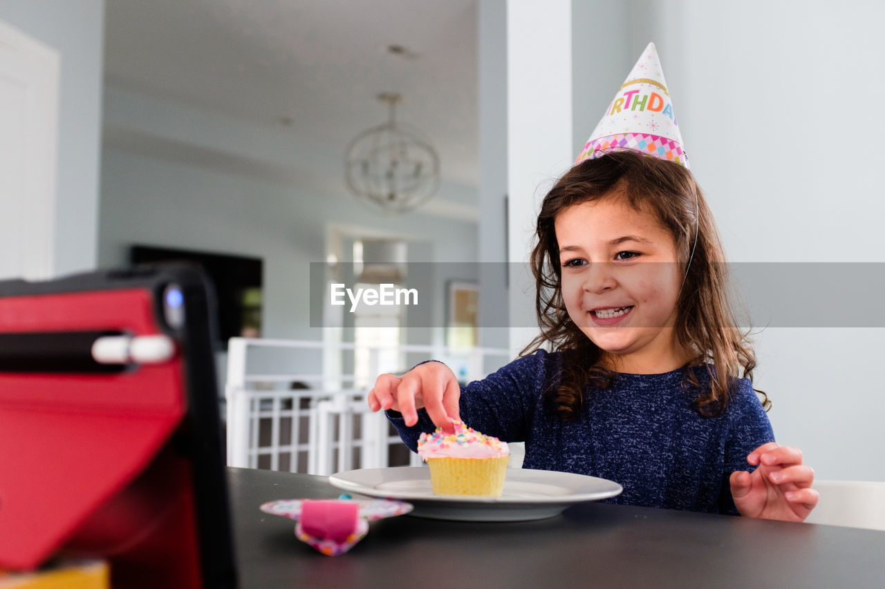 Little girl celebrating birthday virtually due to coronavirus