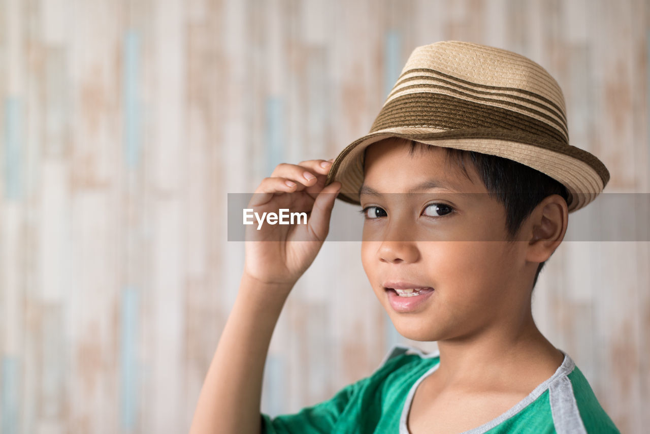 CLOSE-UP OF BOY LOOKING AWAY