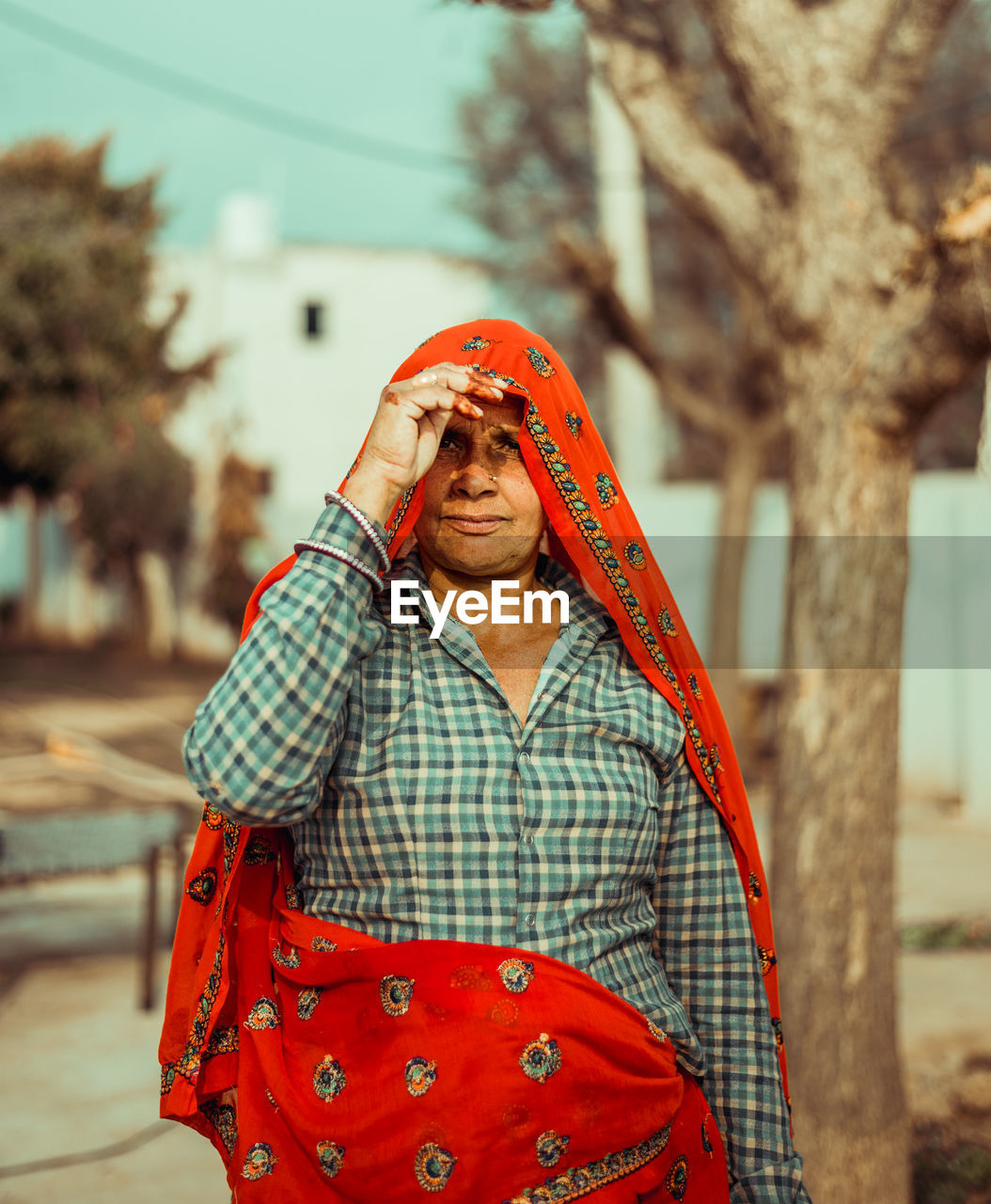 Portrait of an indian rural woman standing outdoors